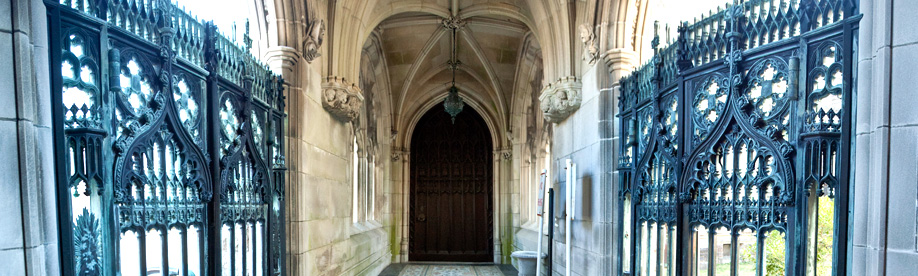 photo of stone archway and metal gates